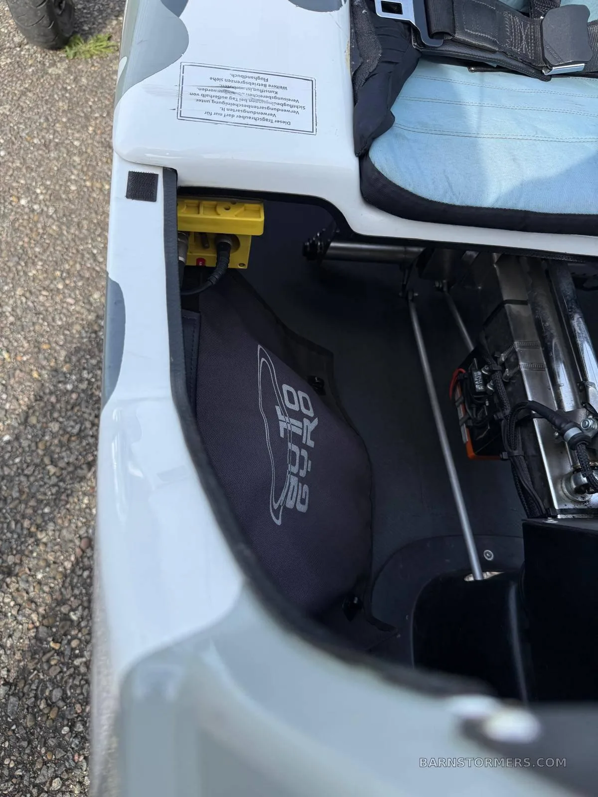 A view into the MTO Sport gyrocopter's interior, showing the footwell, a seat, and internal structure.