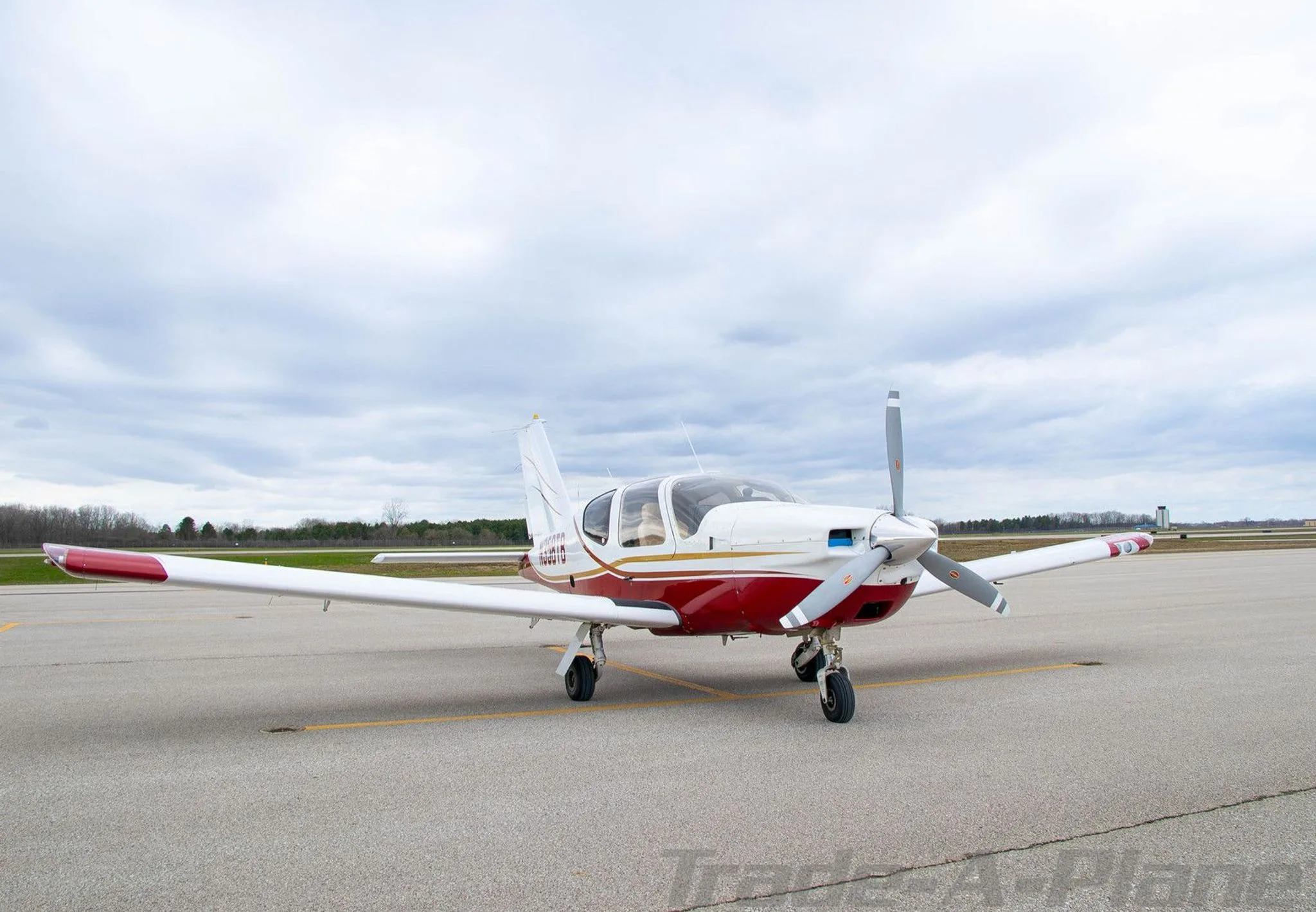 The aircraft is shown from the front on a tarmac.