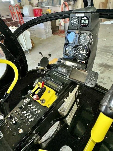 A slightly different angle of the helicopter's cockpit, highlighting the instrument panel and central console.