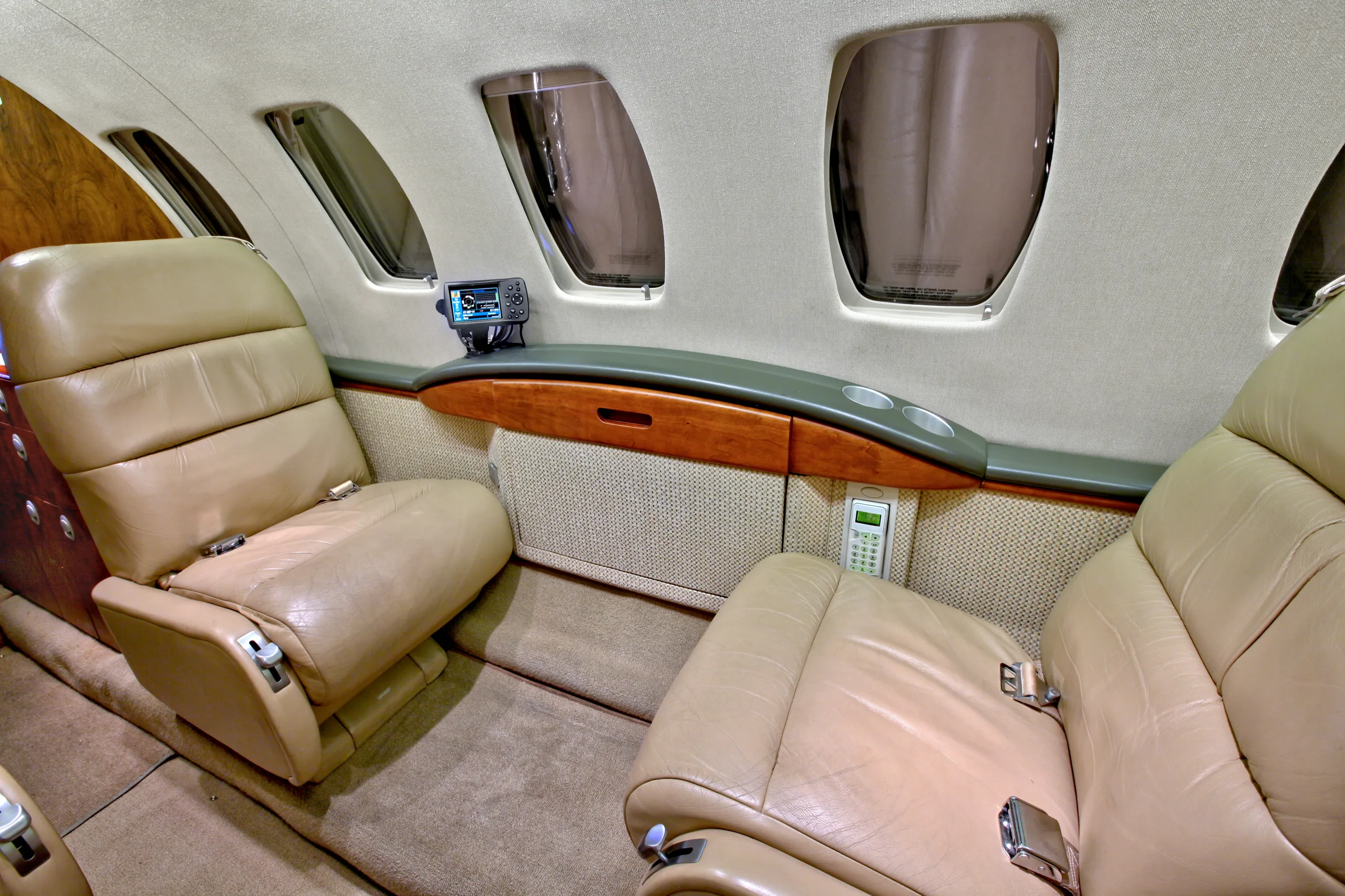 The interior of a Cessna Citation CJ1+ featuring leather seats and side consoles.
