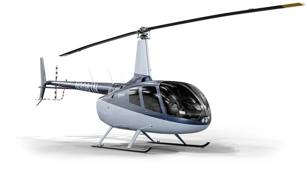 A three-quarter view of a blue and white Robinson R66 helicopter with registration N9081N.