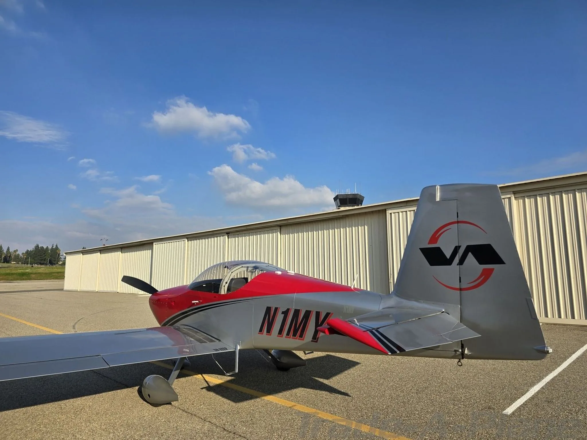 Rear view of the VANS RV-7A with the hangar in the background.