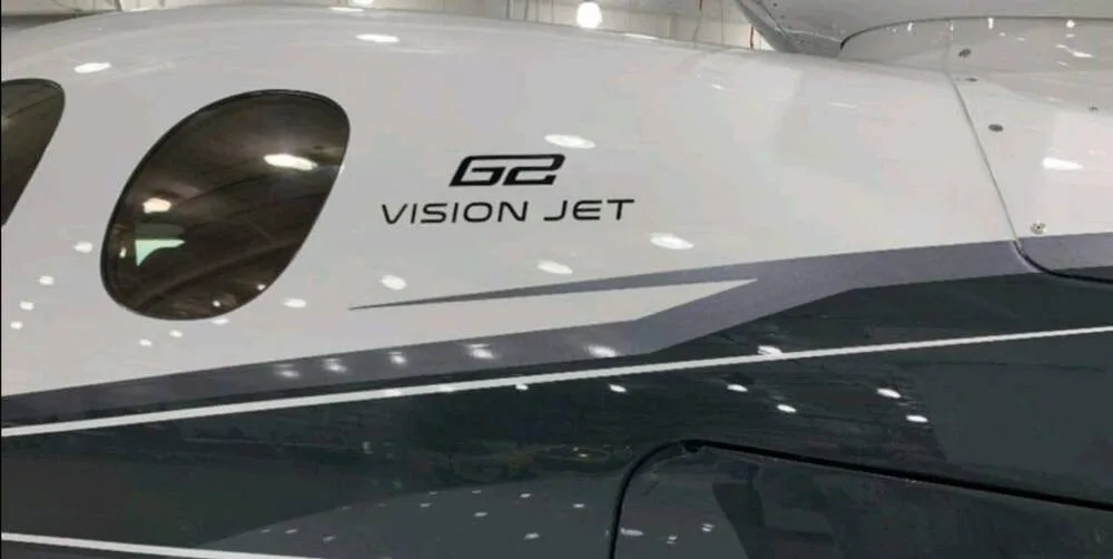A close-up view of the Cirrus G2 Vision Jet branding on the aircraft's fuselage.