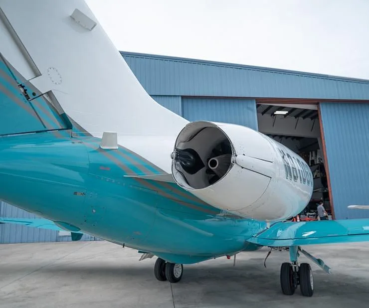 A close-up rear view of the engine and tail of the N810GB Hawker 800XP business jet.