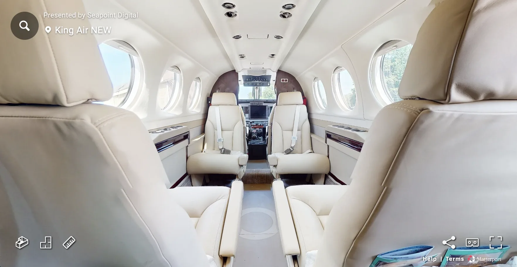 Virtual tour of the King Air cabin showing leather seats and cockpit.
