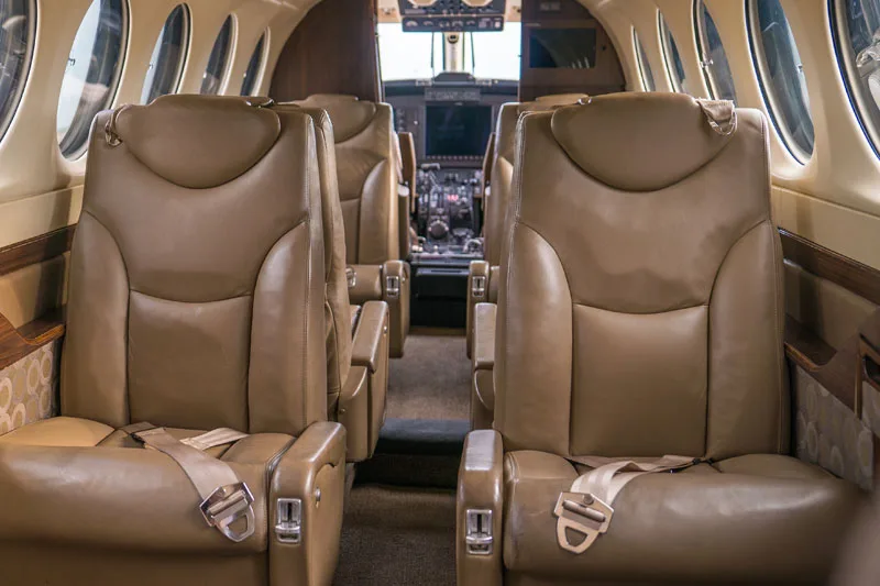 Interior view of the Beechcraft King Air cabin with leather seats.