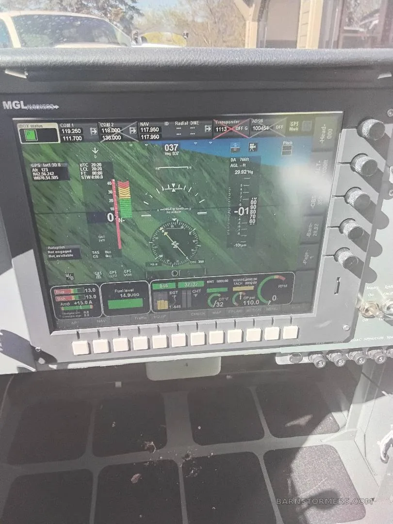 A close-up view of a modern MGL Avionics digital cockpit display showing flight instruments and engine data.