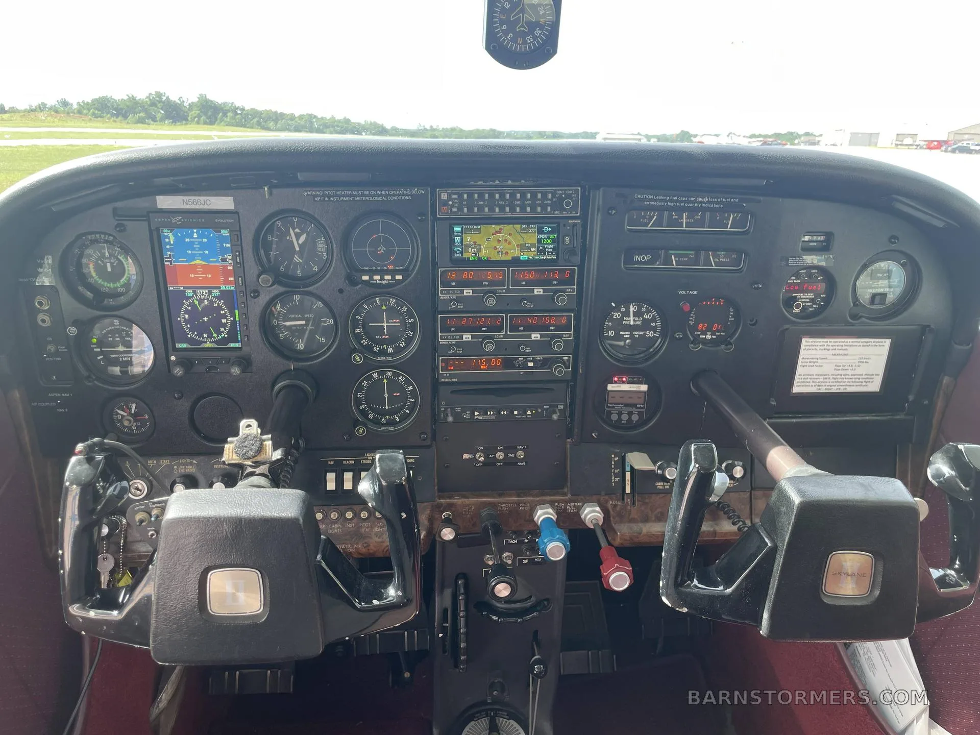 The cockpit of a Cessna aircraft features a detailed instrument panel with analog gauges and modern digital displays.