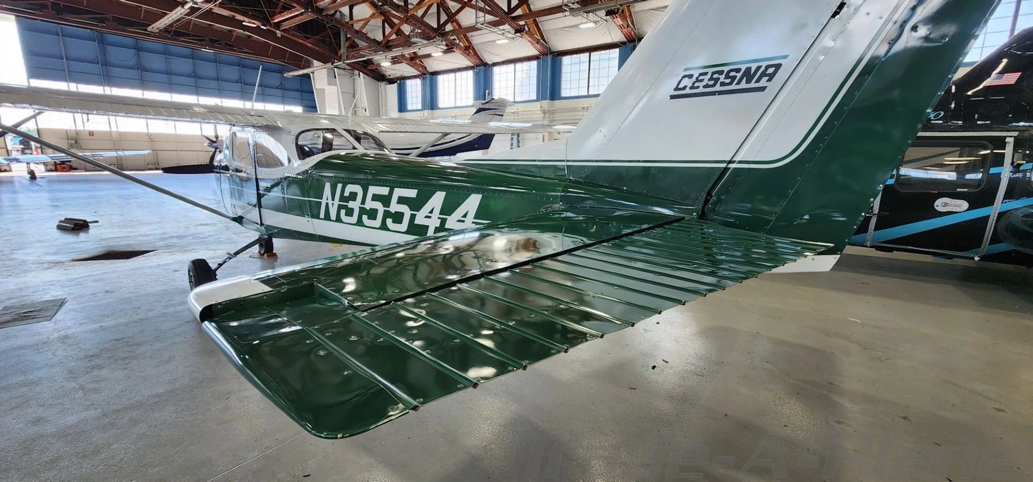 A rear view of the Cessna 172 highlighting the tail.