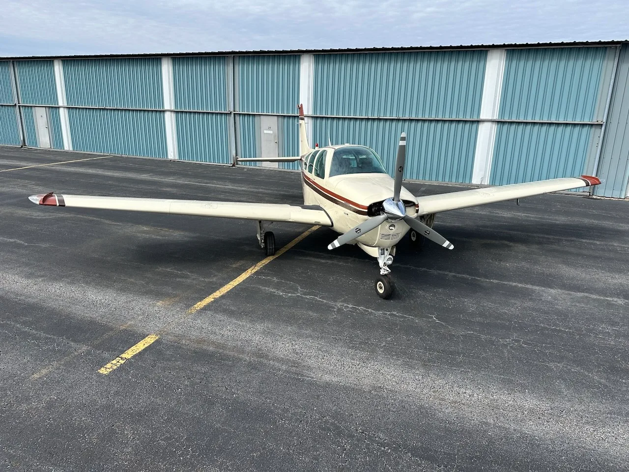Front view of a Beechcraft Bonanza N1550D on the tarmac.