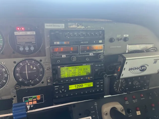Close-up view of the aircraft's avionics stack, including radios and navigation equipment.