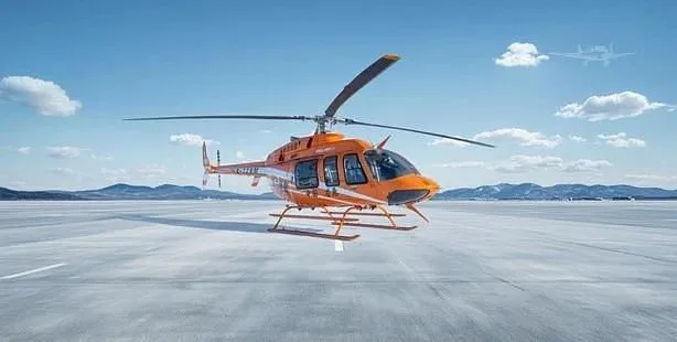 A bright orange helicopter with registration B-728M is parked on a snowy runway under a blue sky, with a faint ghost plane in the distance.