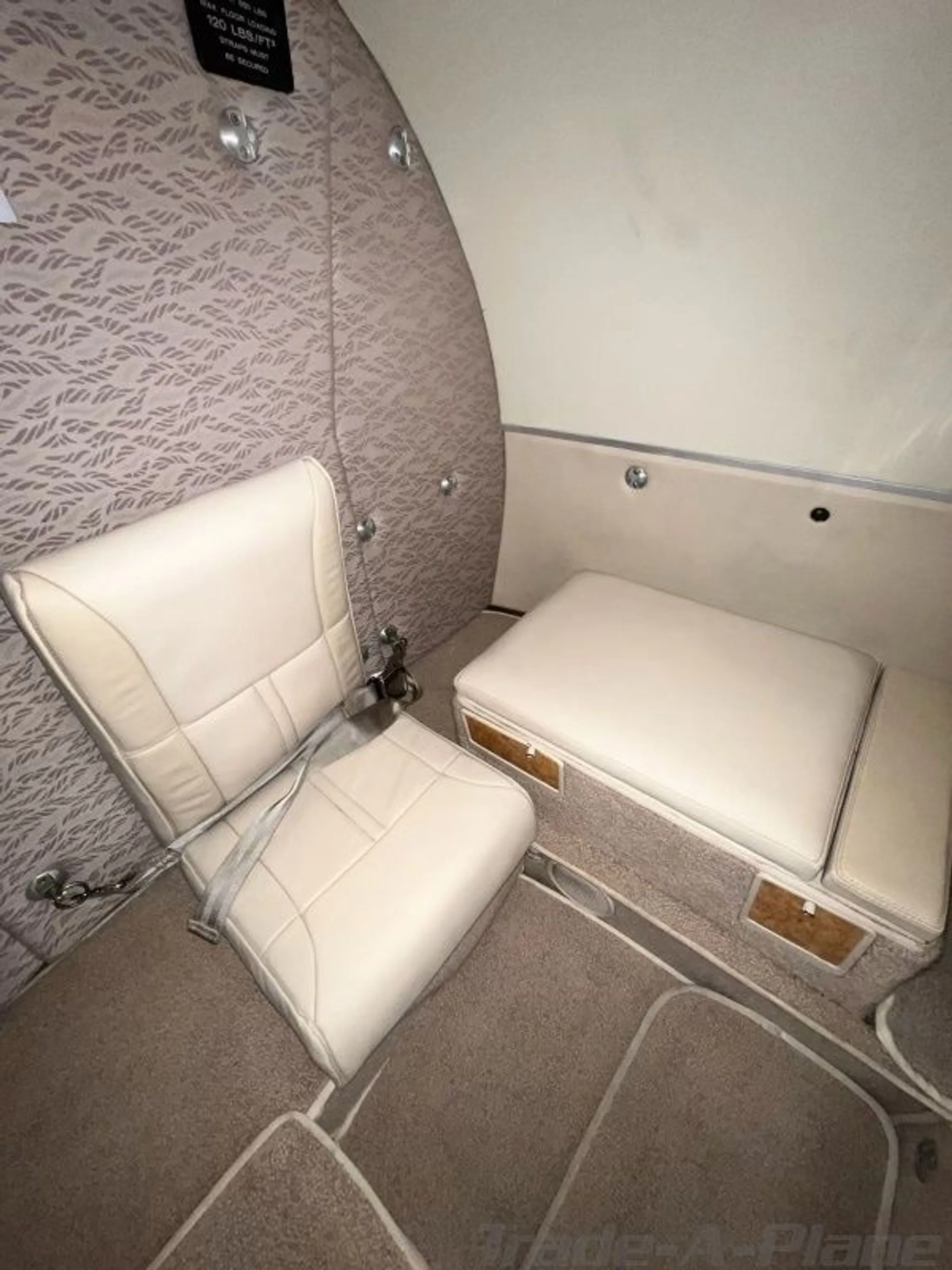 Interior view showing a single seat and space.