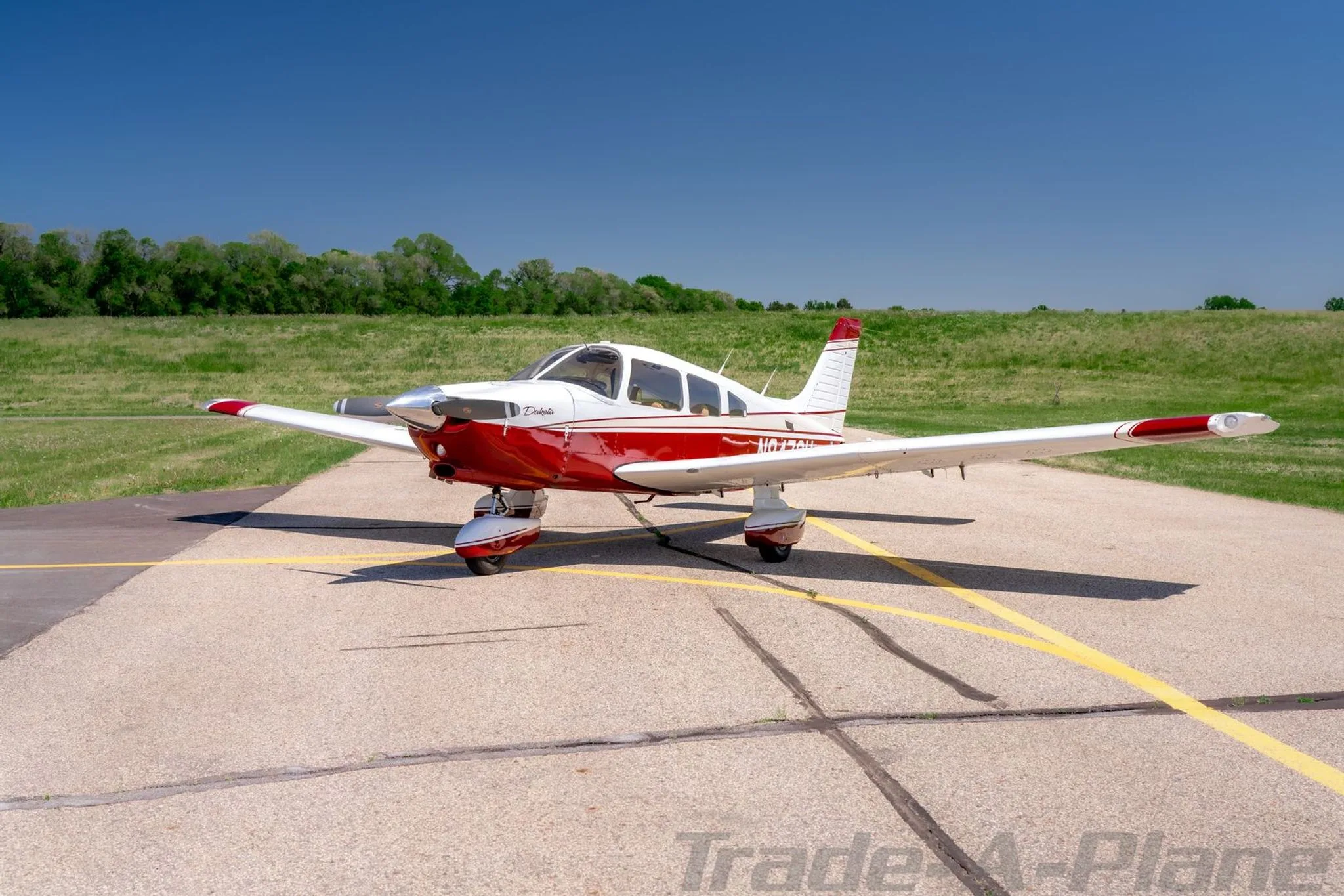 A front view of the Piper Dakota on the runway.