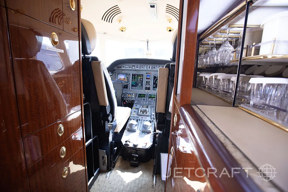 View of the cockpit from the galley area of the jet.
