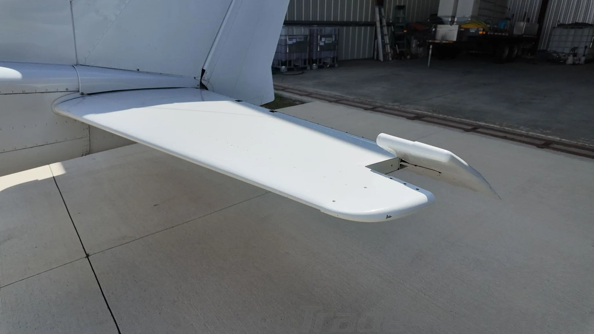 A close-up view of the white horizontal stabilizer and elevator of the Cessna 172 Skyhawk.