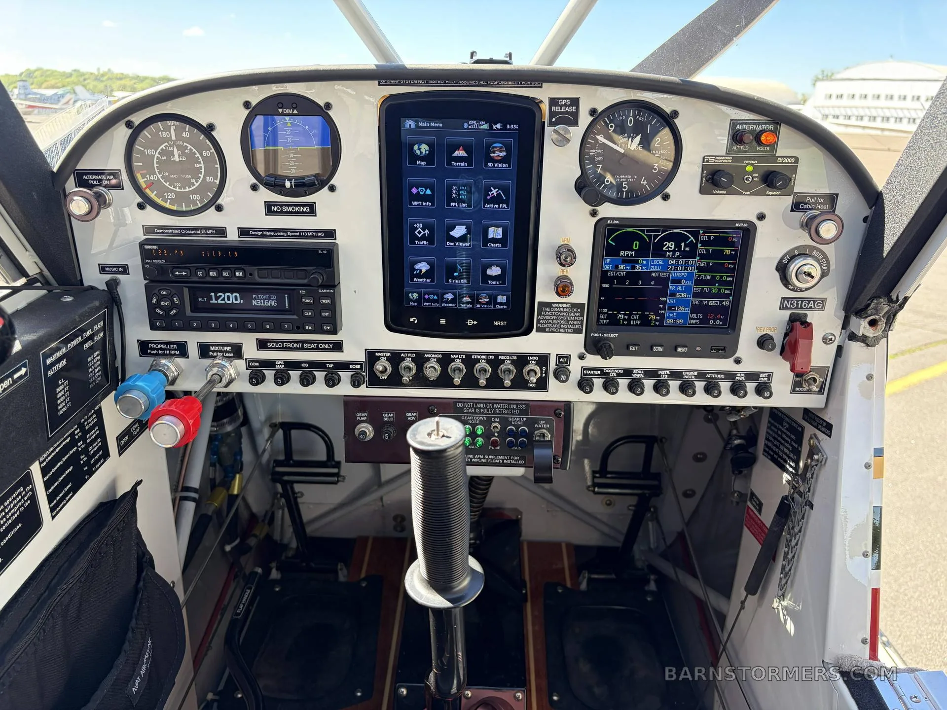 The modern instrument panel of a light aircraft, featuring multiple digital displays and analog gauges, with registration N316AG visible.