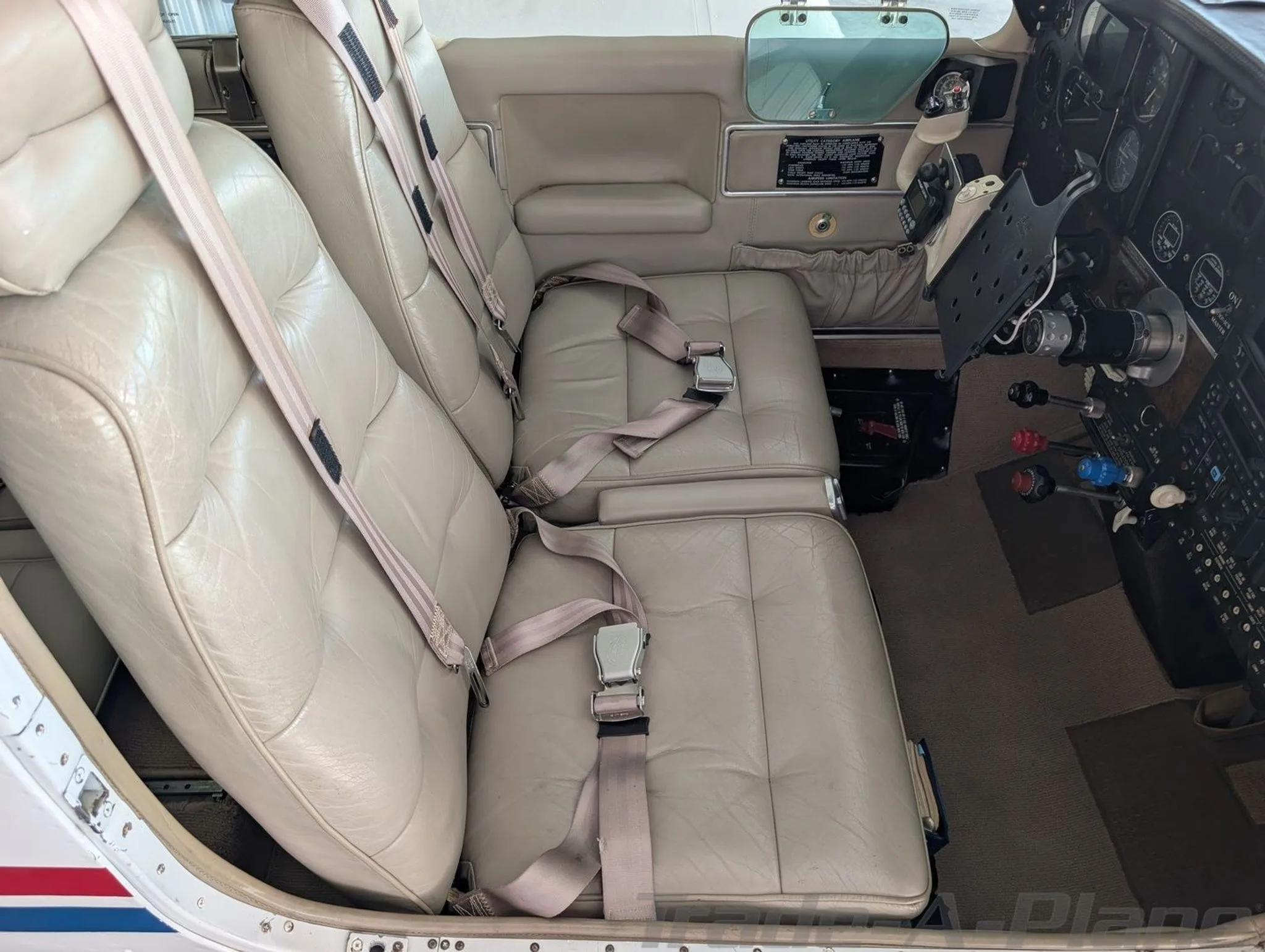 The cockpit area with two pilot seats and control instruments.