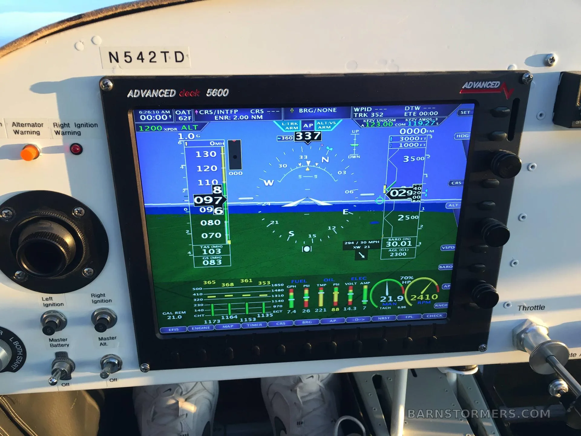 A close-up view of an Advanced Deck 5600 glass cockpit display showing flight information and engine parameters.