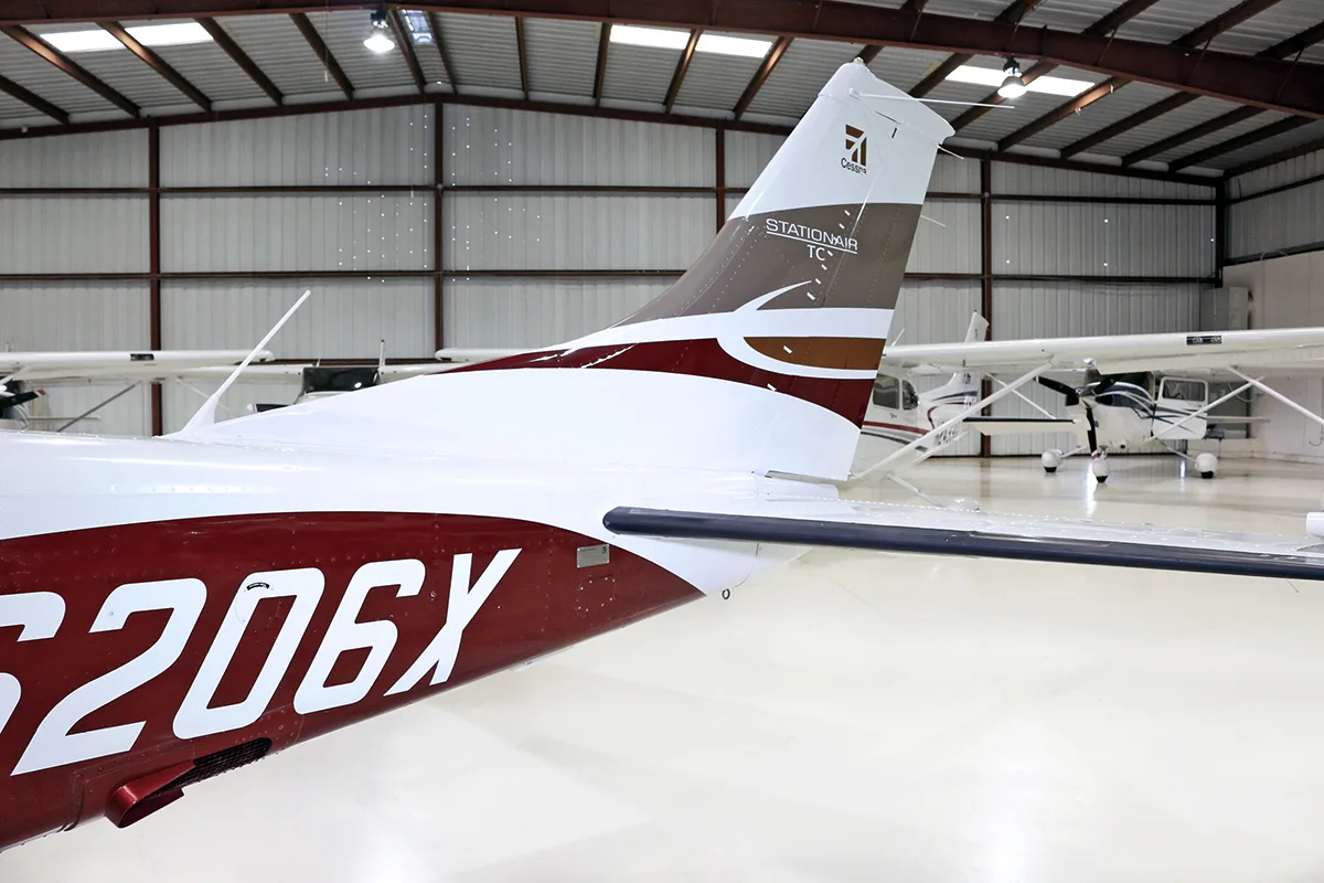A close-up view of the tail section of the Cessna Stationair TC N6206X, showing the registration and paint scheme.