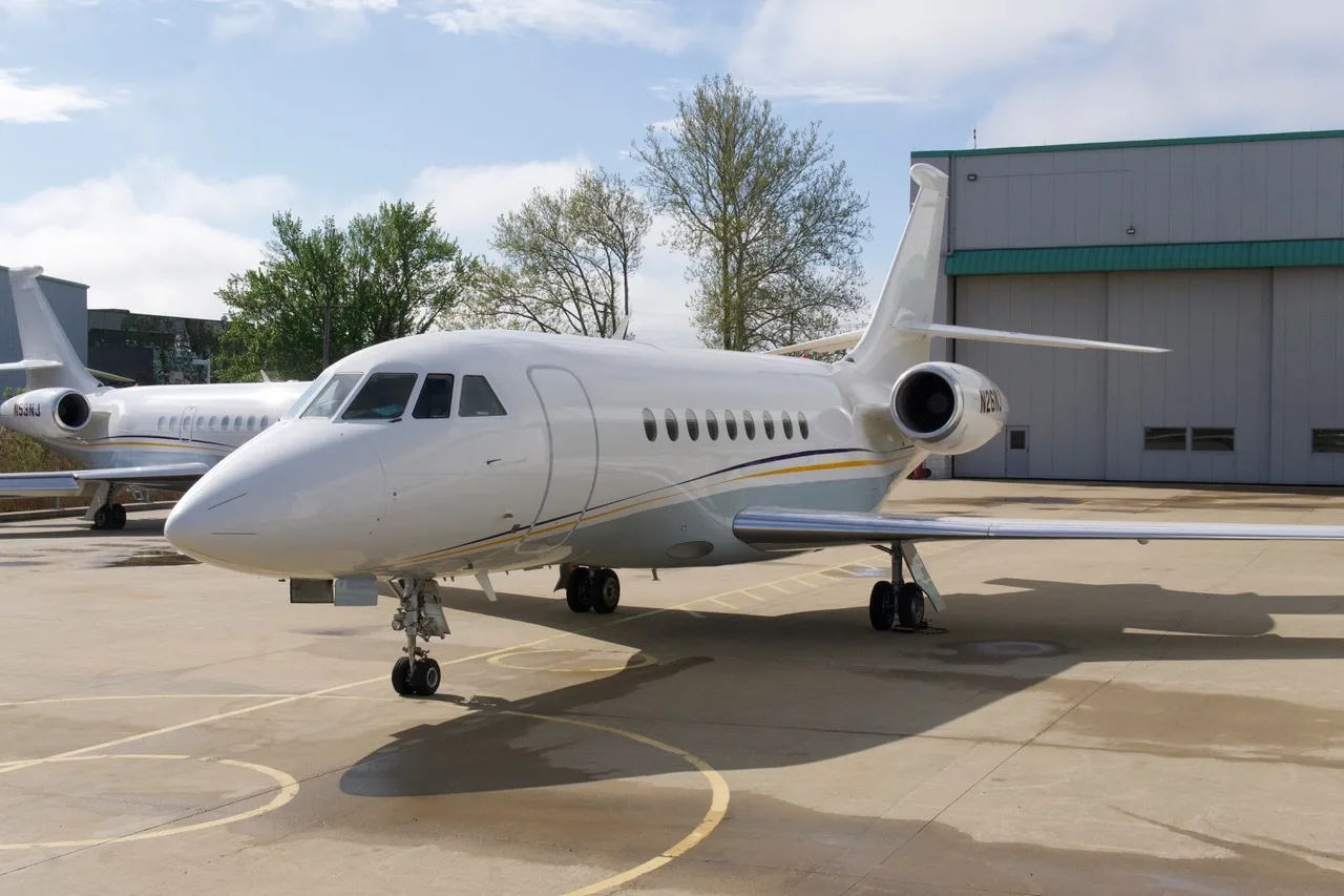 Front view of the aircraft N26NJ parked on the tarmac.