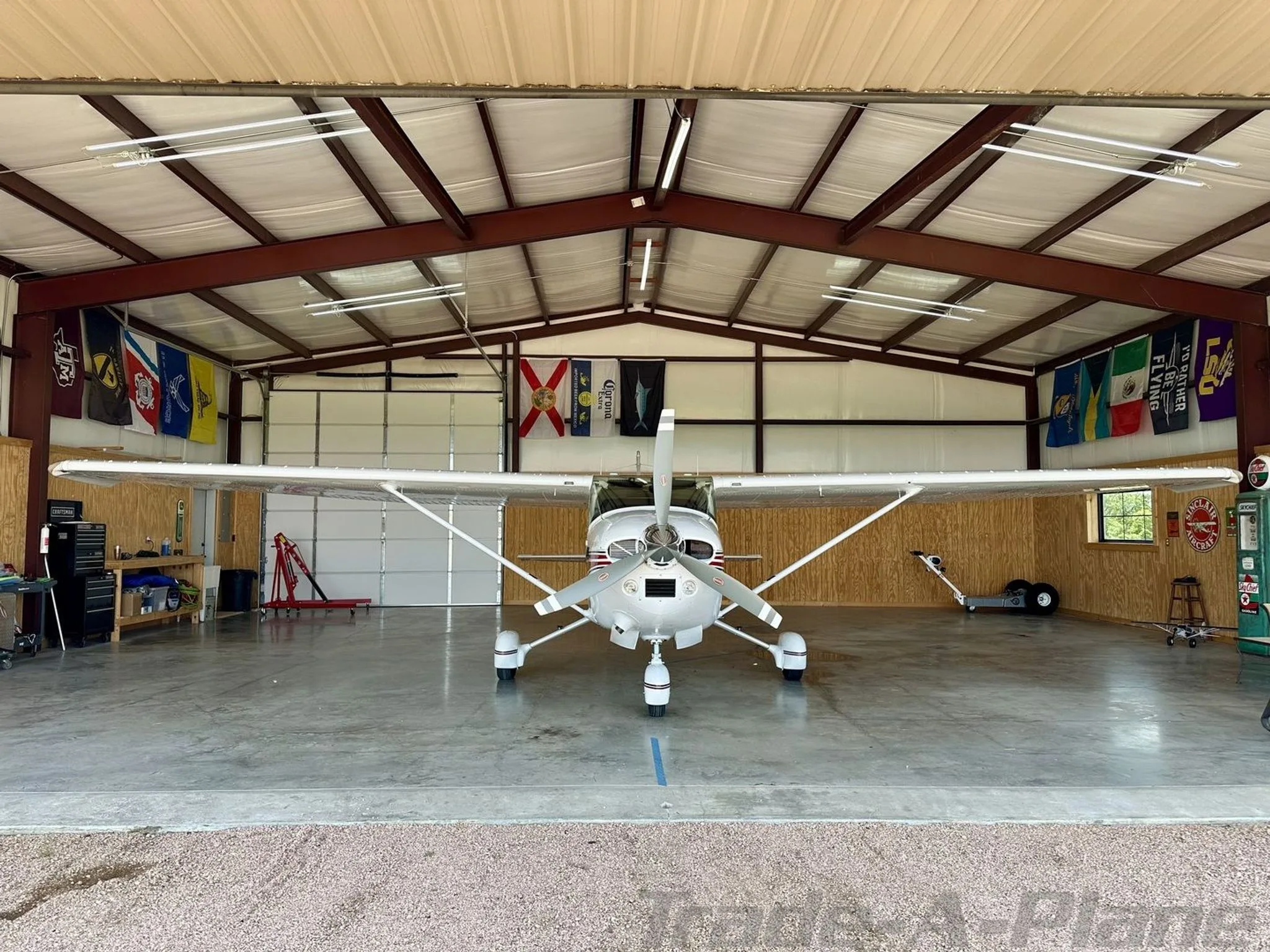 Front view of the Cessna 182R Skylane in a hangar.