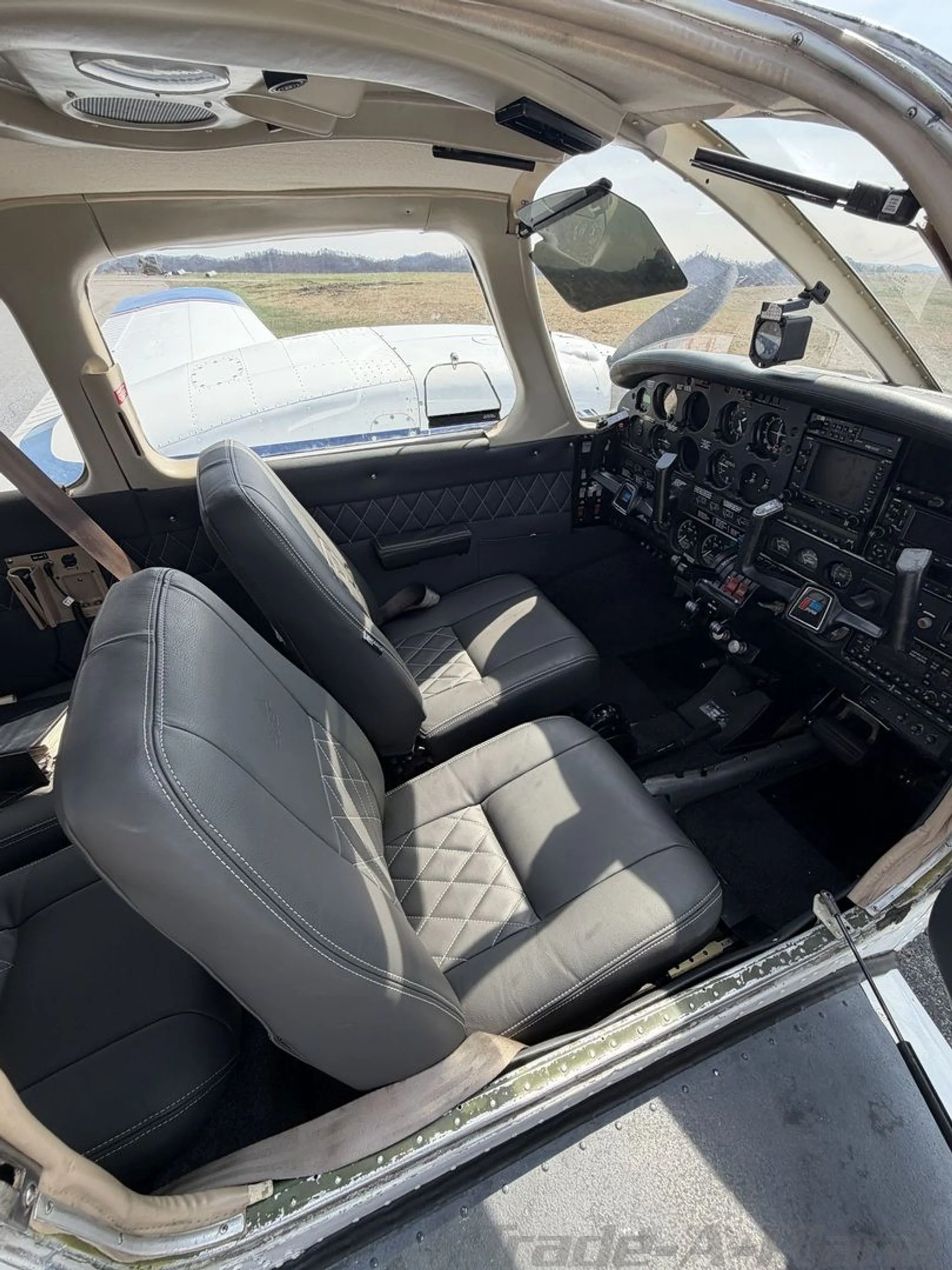 A view of the cockpit with pilot seats and controls.