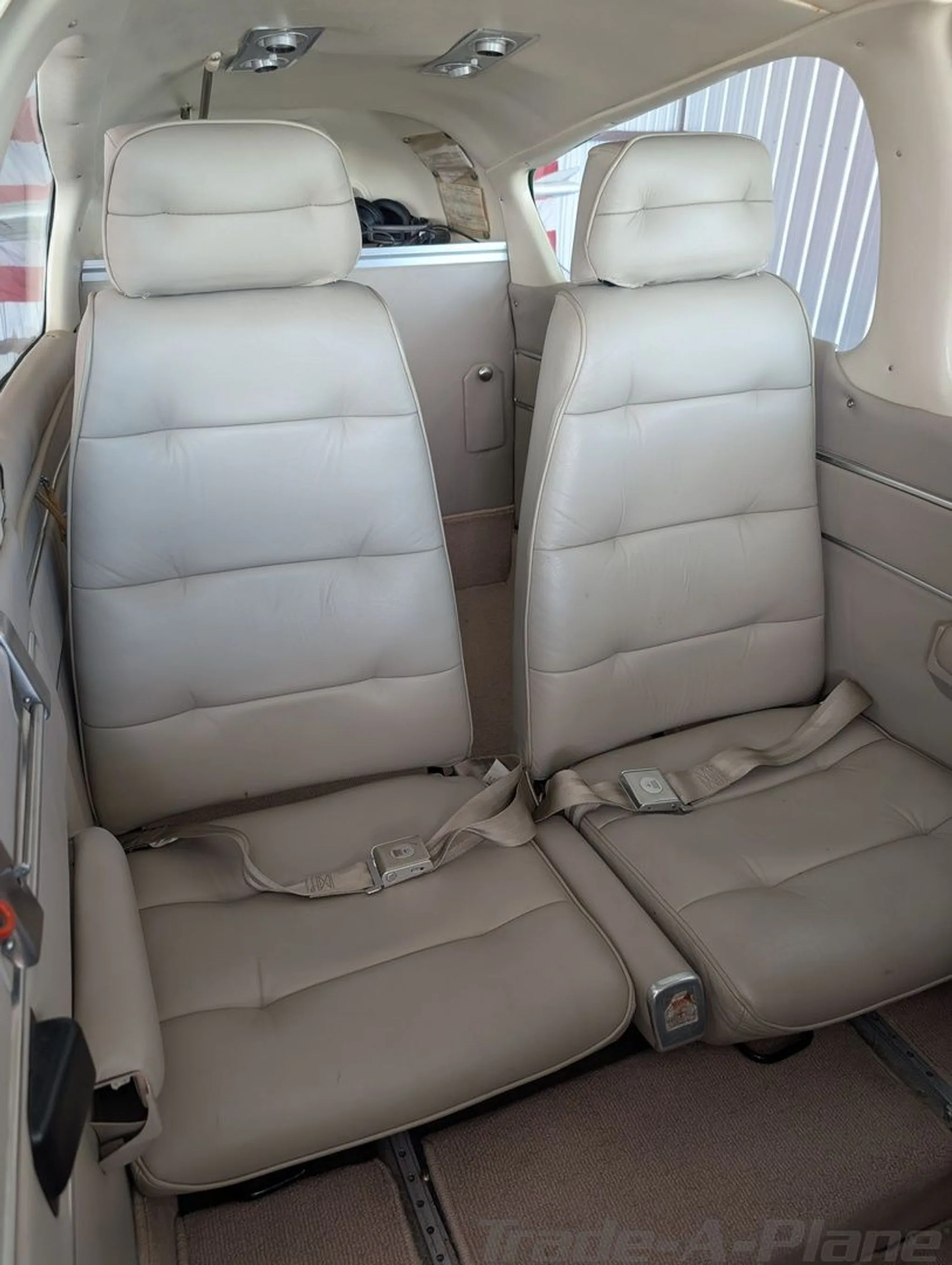 The interior cabin features two leather seats.