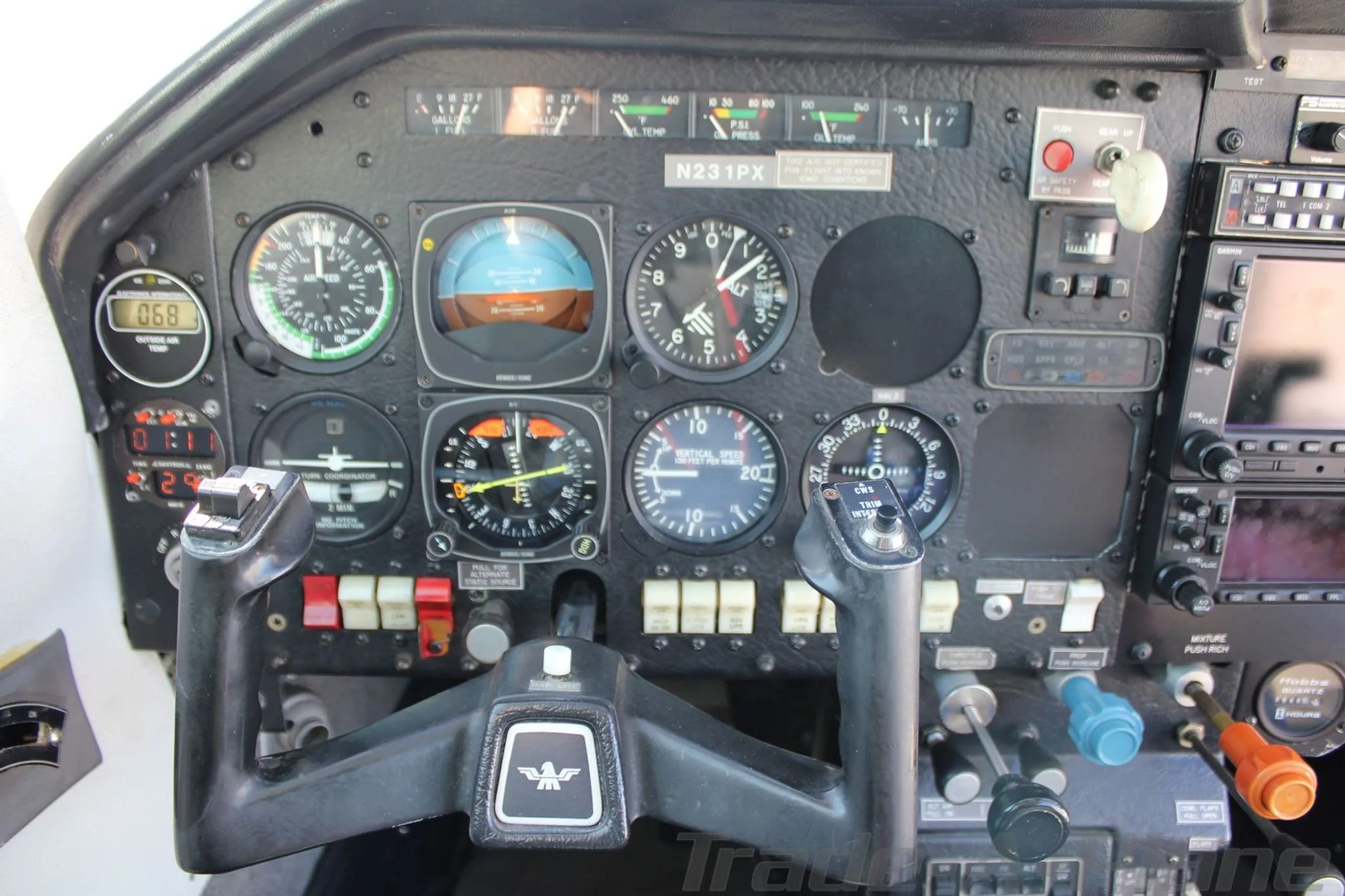 Close-up view of the aircraft's instrument panel with various gauges and controls.
