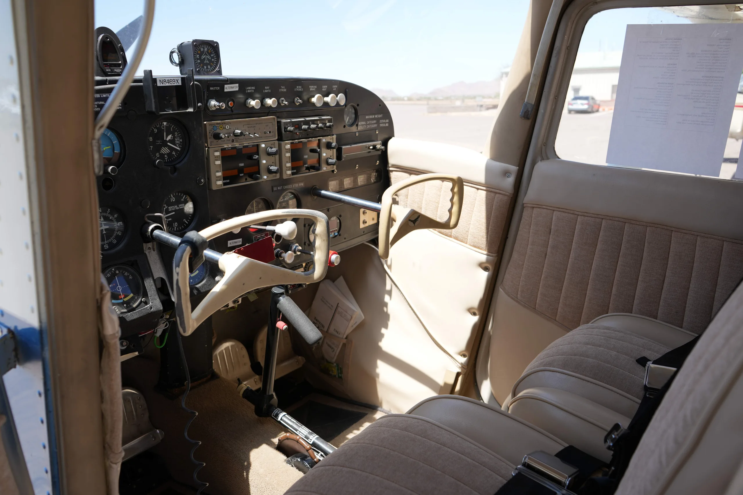 View of the instrument panel and front passenger seat of a Cessna 172 cockpit.