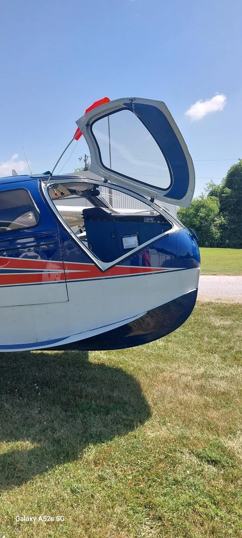The rear hatch of the N6386K amphibious aircraft is open, revealing part of the interior.