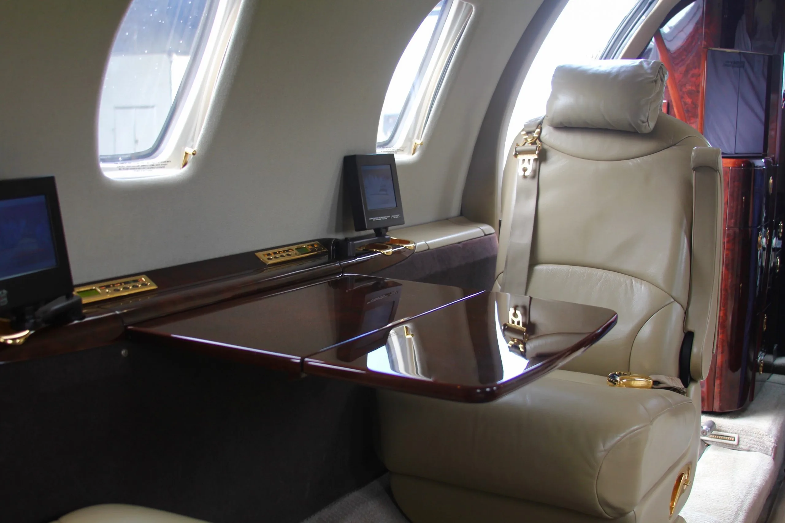 Interior of the aircraft with a table and seat.