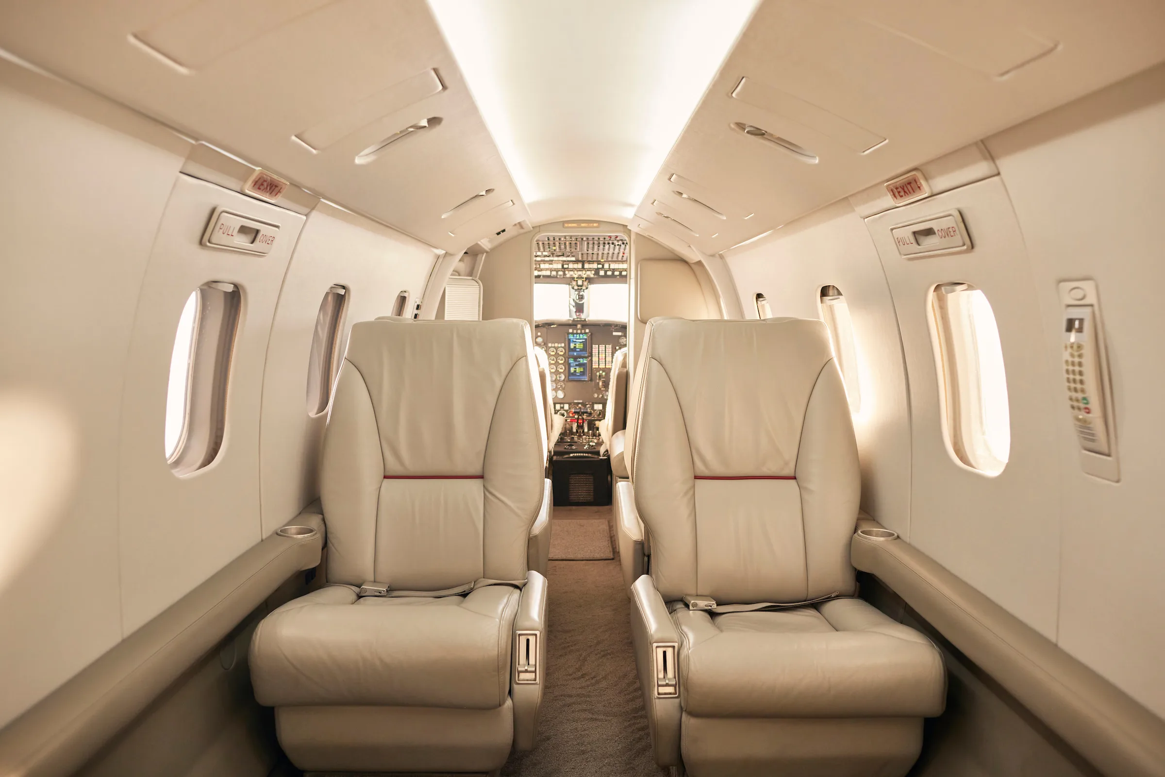 The interior of a Westwind Astra SPX aircraft, showing the cabin seats and layout.