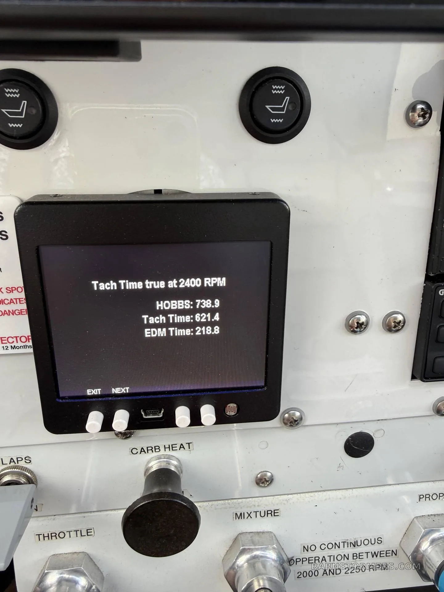 A close-up of an aircraft display showing Hobbs, Tach, and EDM time readings.