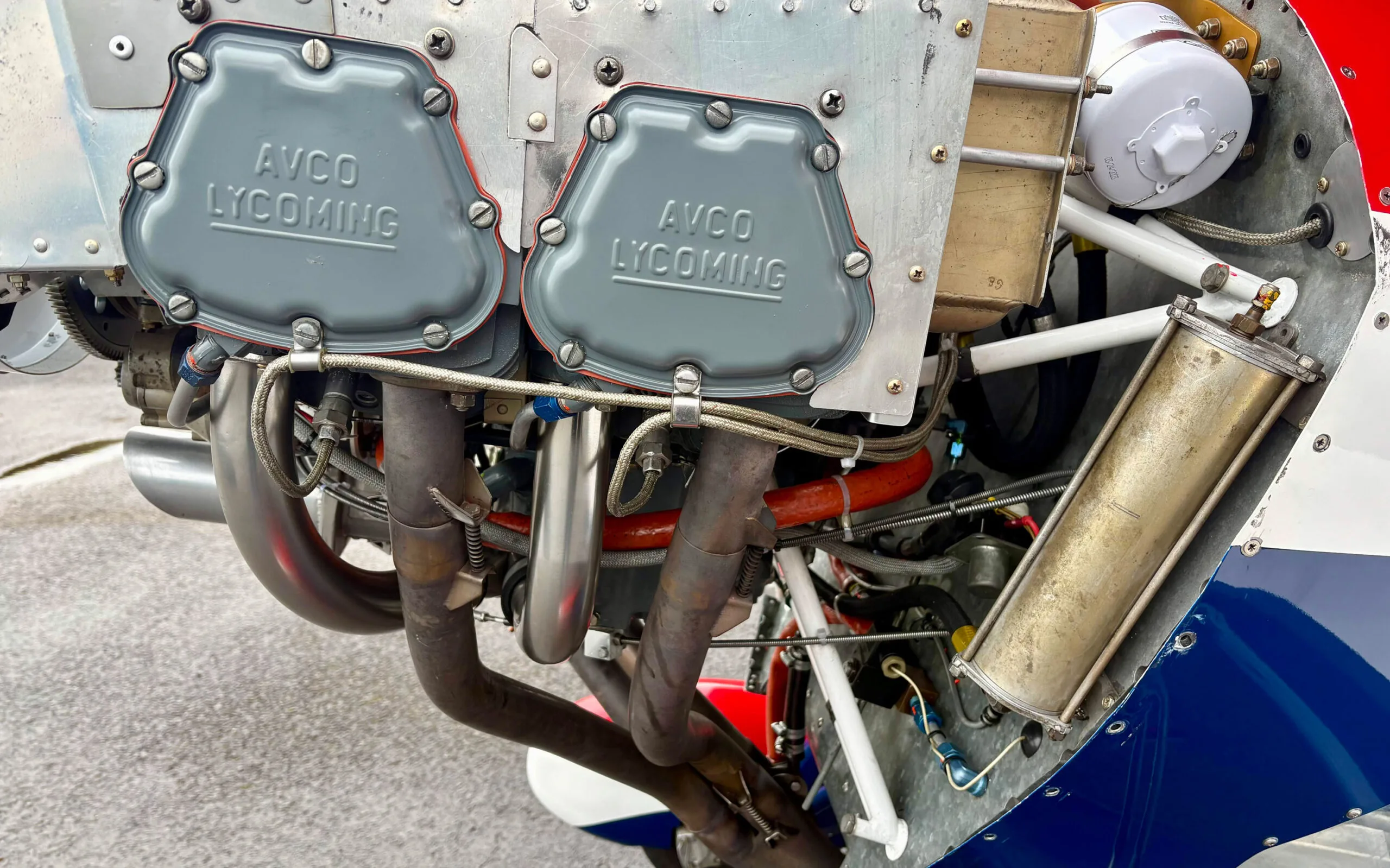 A close-up view of the AVCO Lycoming engine cylinders and exhaust manifold of the Pitts S1T biplane.
