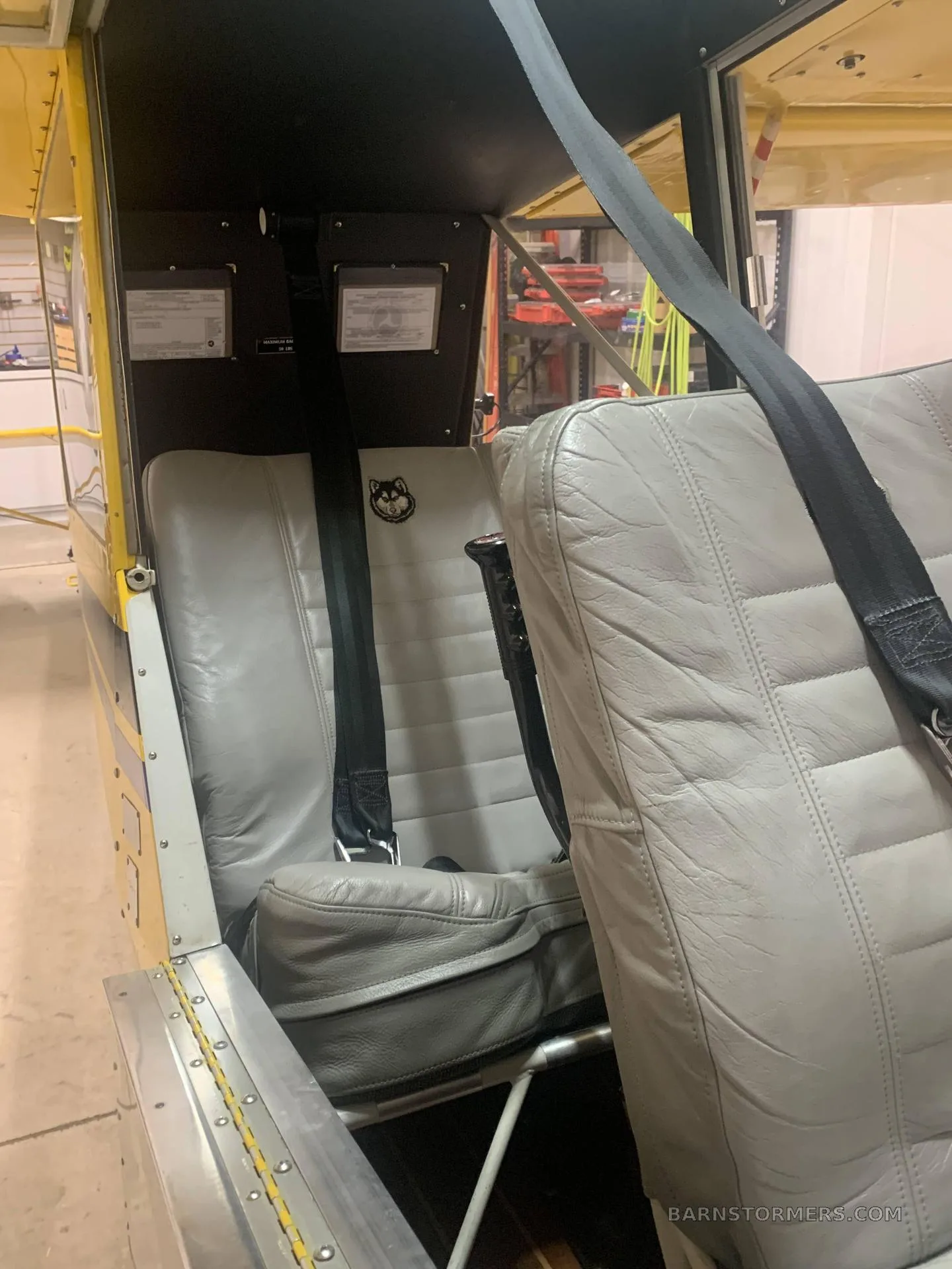 The light gray leather seats and interior cabin of an Aviat Husky A-1 aircraft.