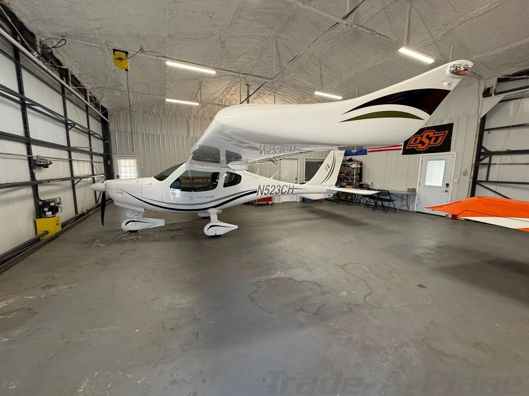 Another angle of the aircraft parked in the hangar.