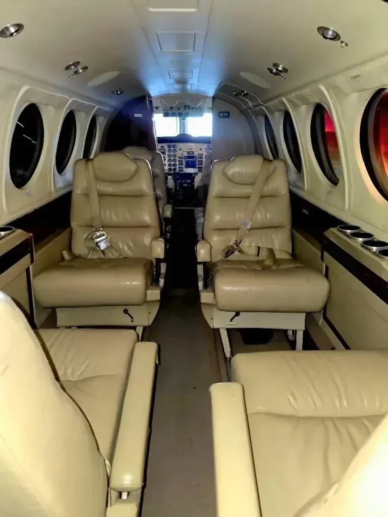 View of the aircraft's cabin seats and cockpit.