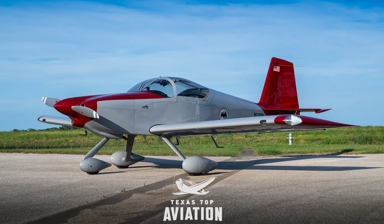 A side view of the gray and red single-engine aircraft, N1359L, with its tail number clearly visible on the fuselage.