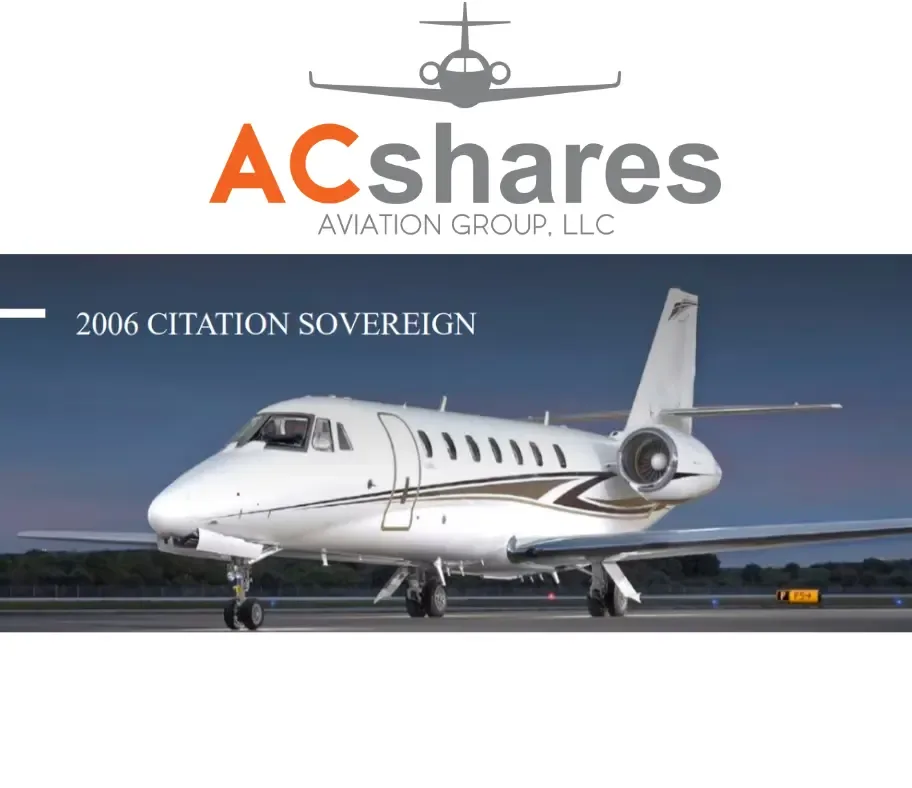 A white 2006 Citation Sovereign business jet with brown stripes on a tarmac at dusk.