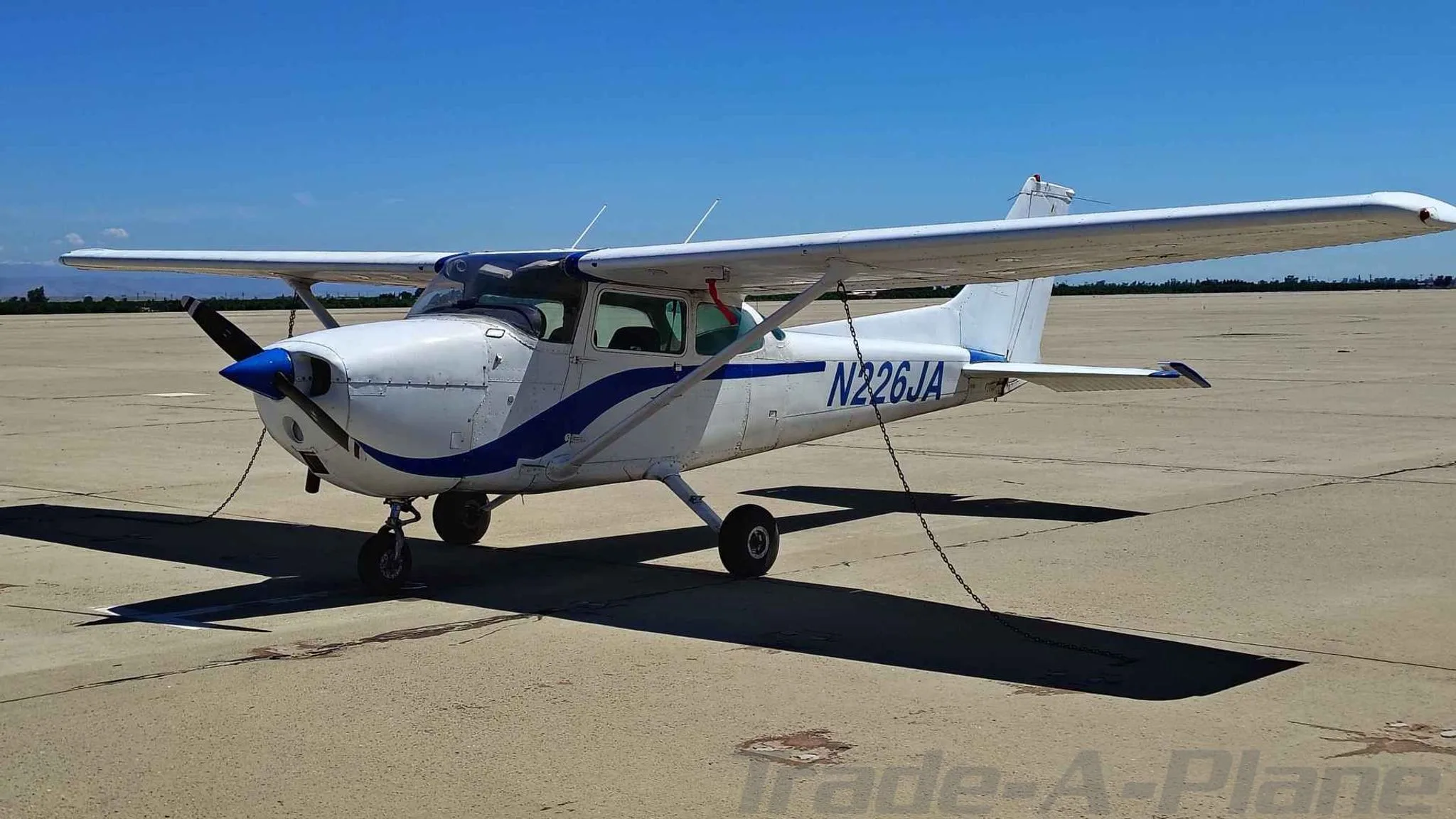 A Cessna 172M Skyhawk parked on the tarmac.