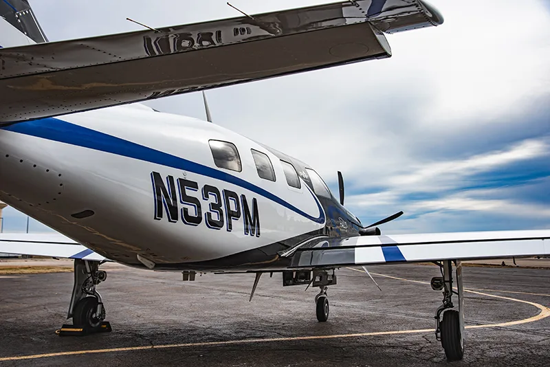 The tail of the N53PM aircraft is visible, showing the registration number.