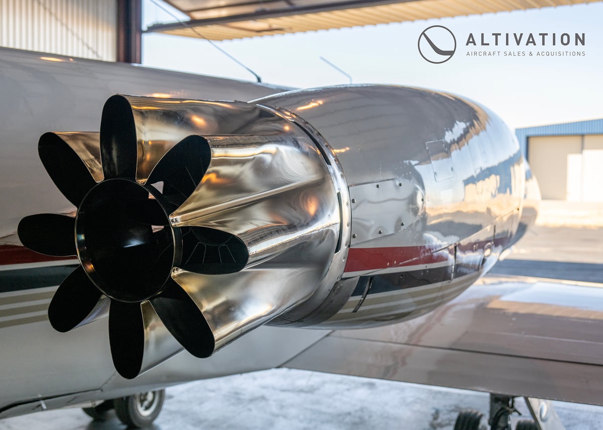 Front view of a Learjet in a hangar.