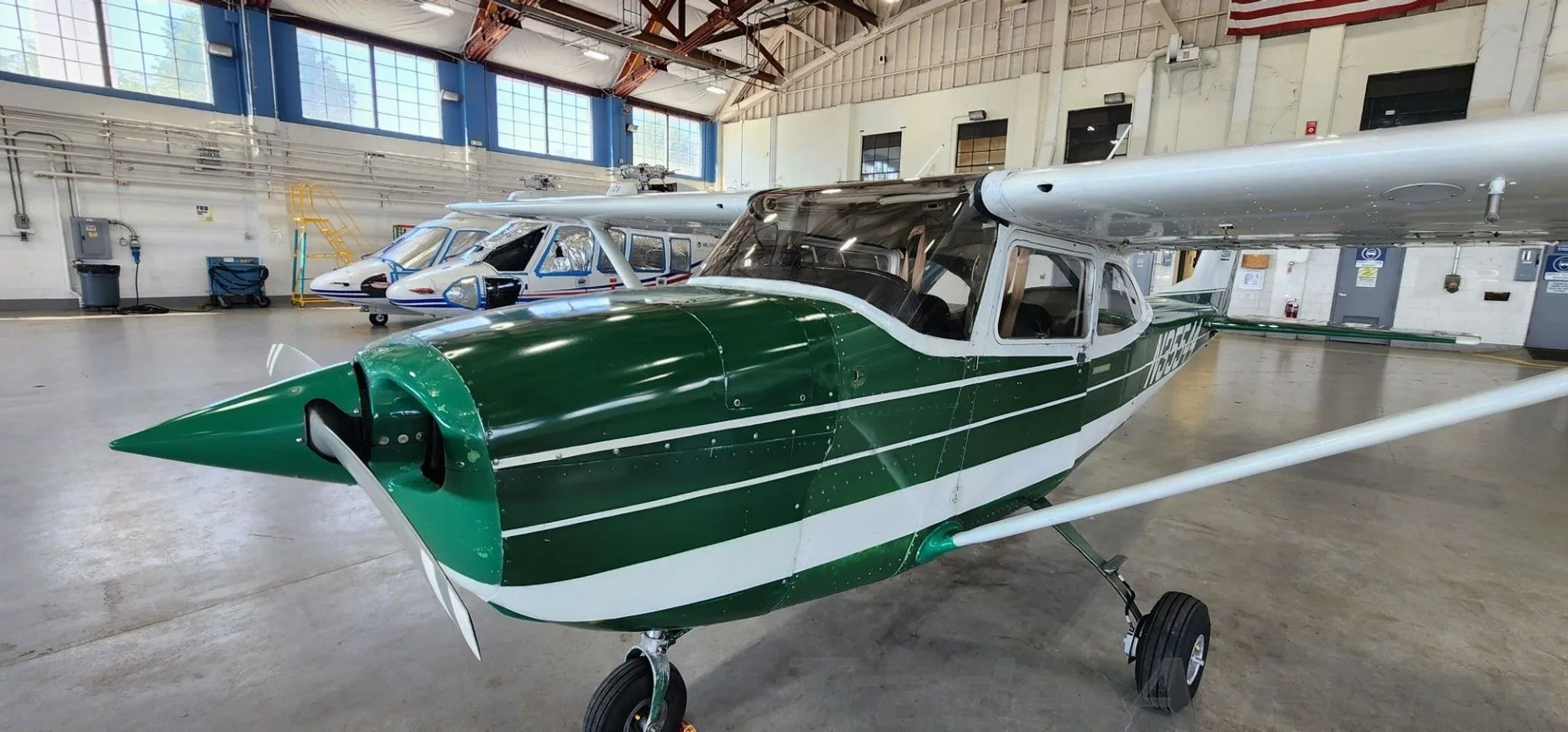 A frontal view of the Cessna 172 in the hangar.