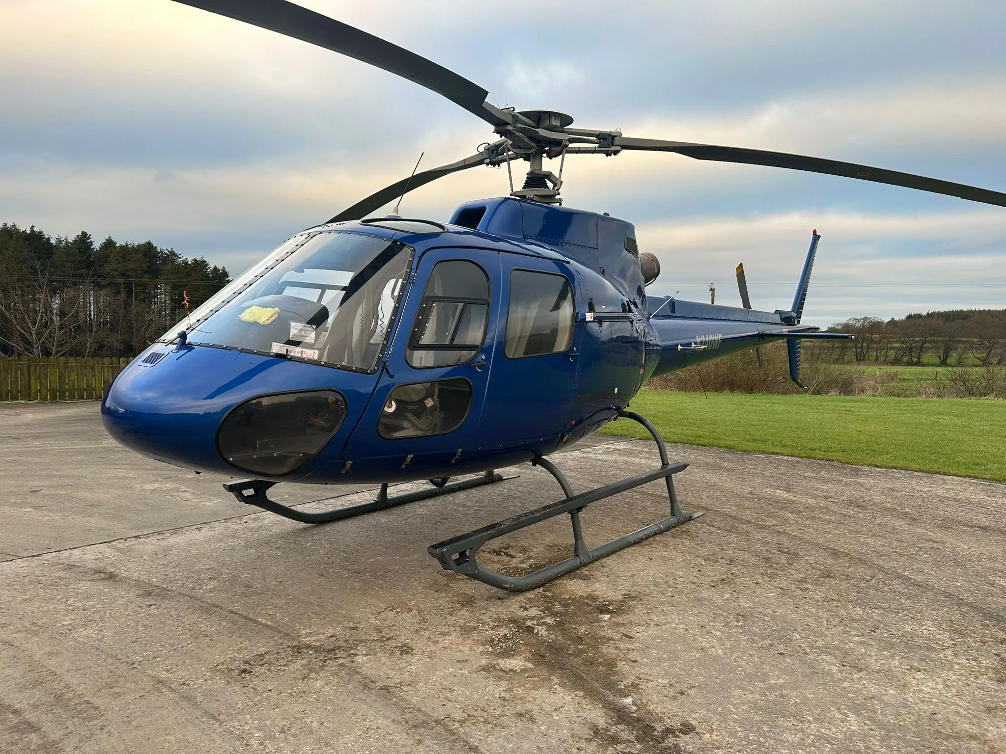 Close-up of the N240WF helicopter on the ground.