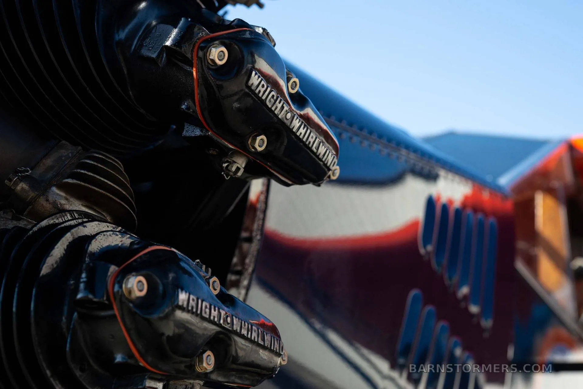 A close-up detail of the black cylinders of a Wright Whirlwind radial engine on a vintage aircraft.