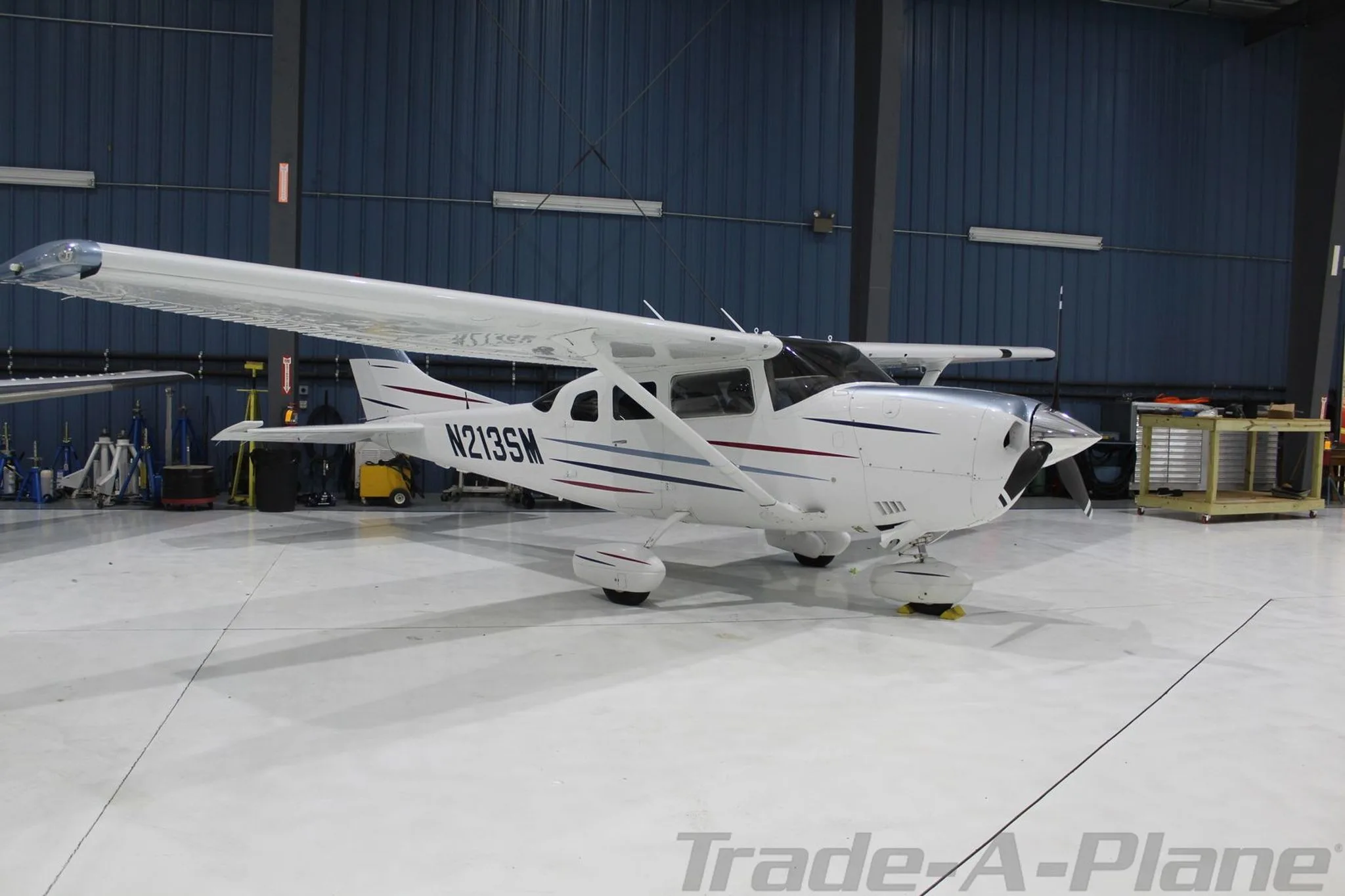 A Cessna 206H Stationair parked in a hangar.