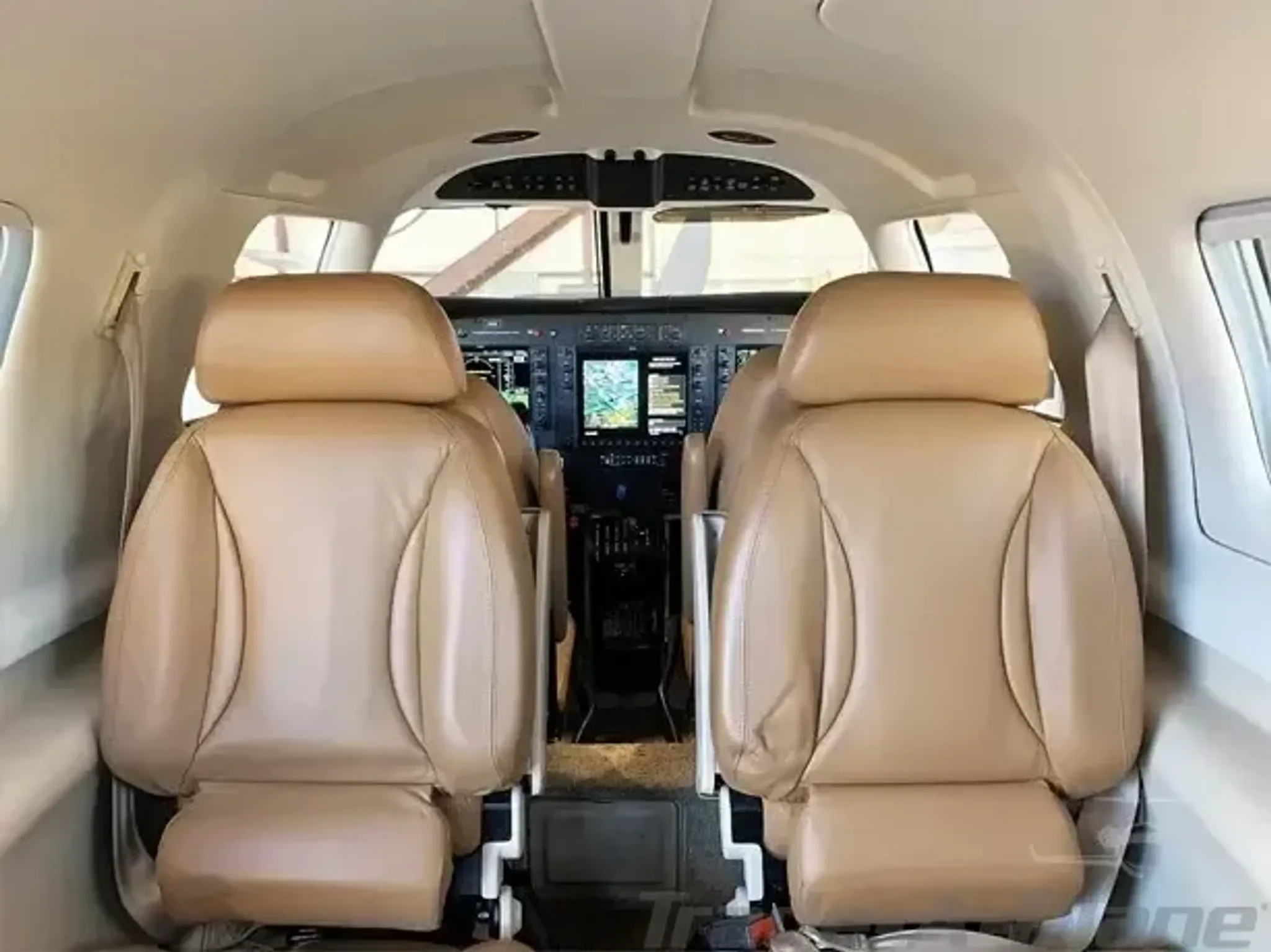 View of the cockpit seats and instrument panel.