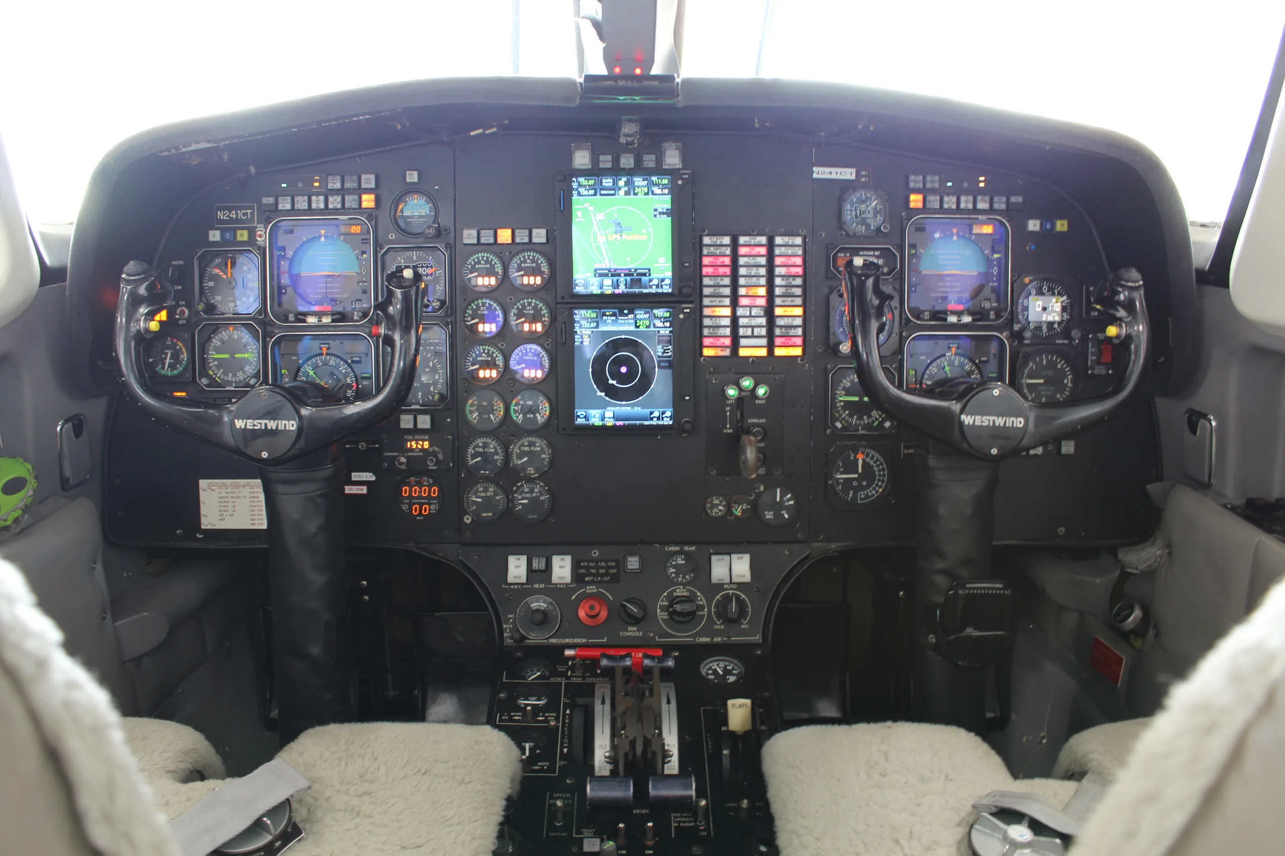 The cockpit of a Westwind Astra SPX aircraft, featuring the instrument panel and controls.