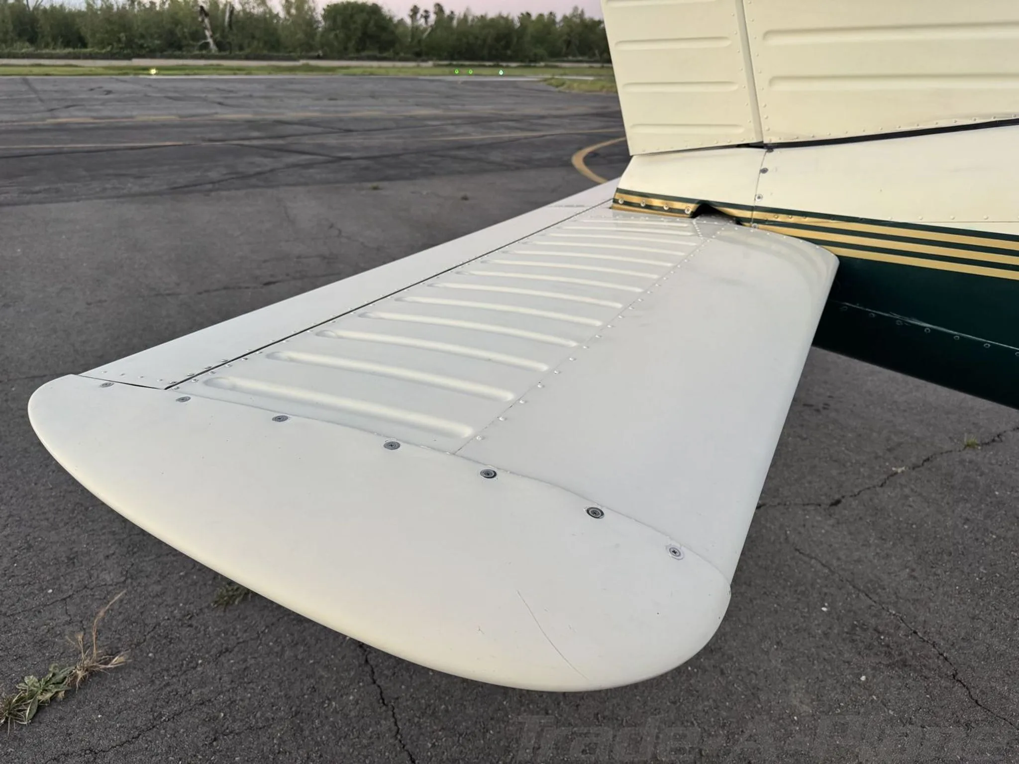 A close-up view of the white horizontal stabilizer of the N3683R aircraft.